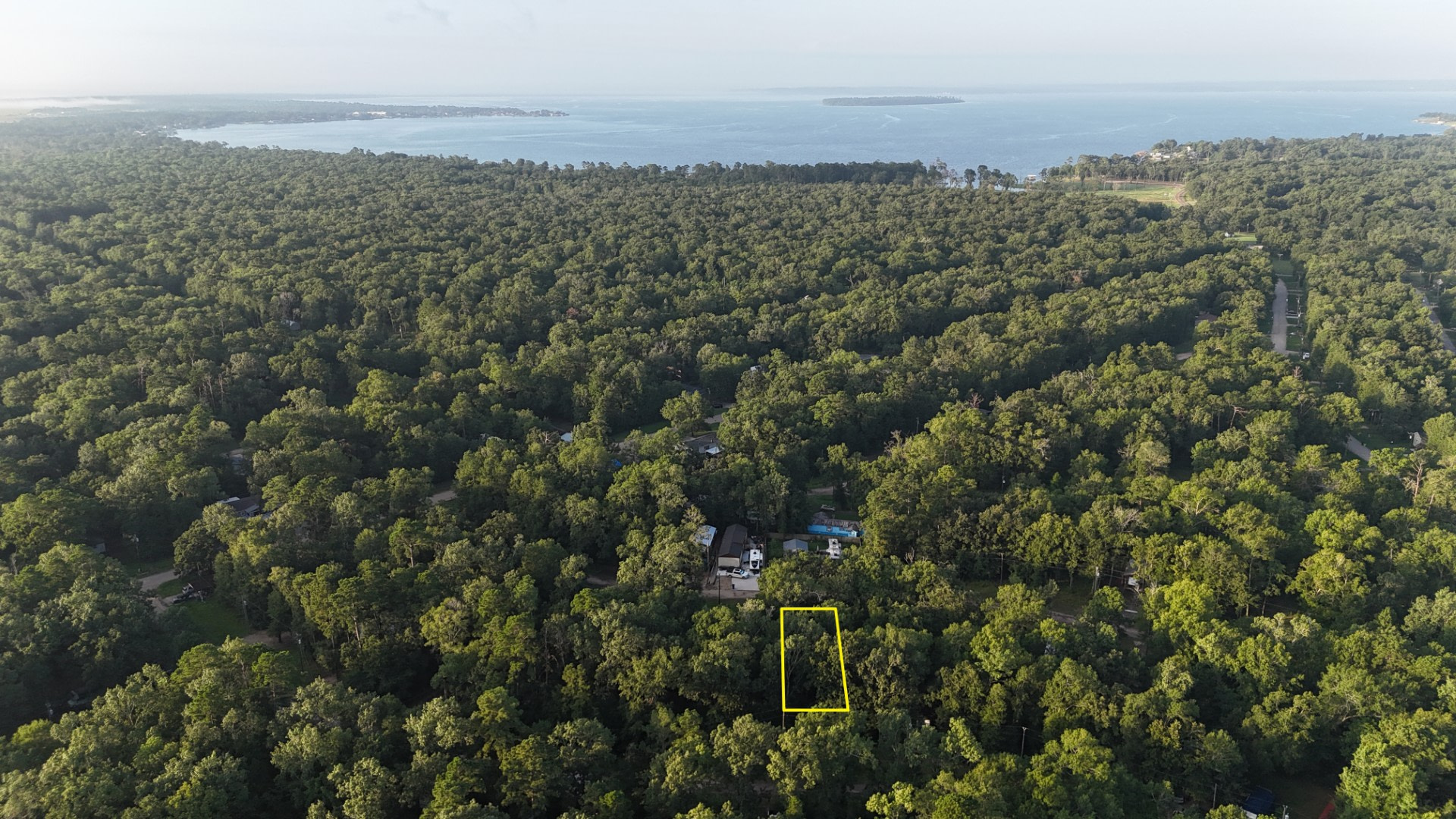 0.09 Acre Lot! Full-Time RV Living. Paved Frontage, Underground Power, Water, Sewer Available in Polk, TX